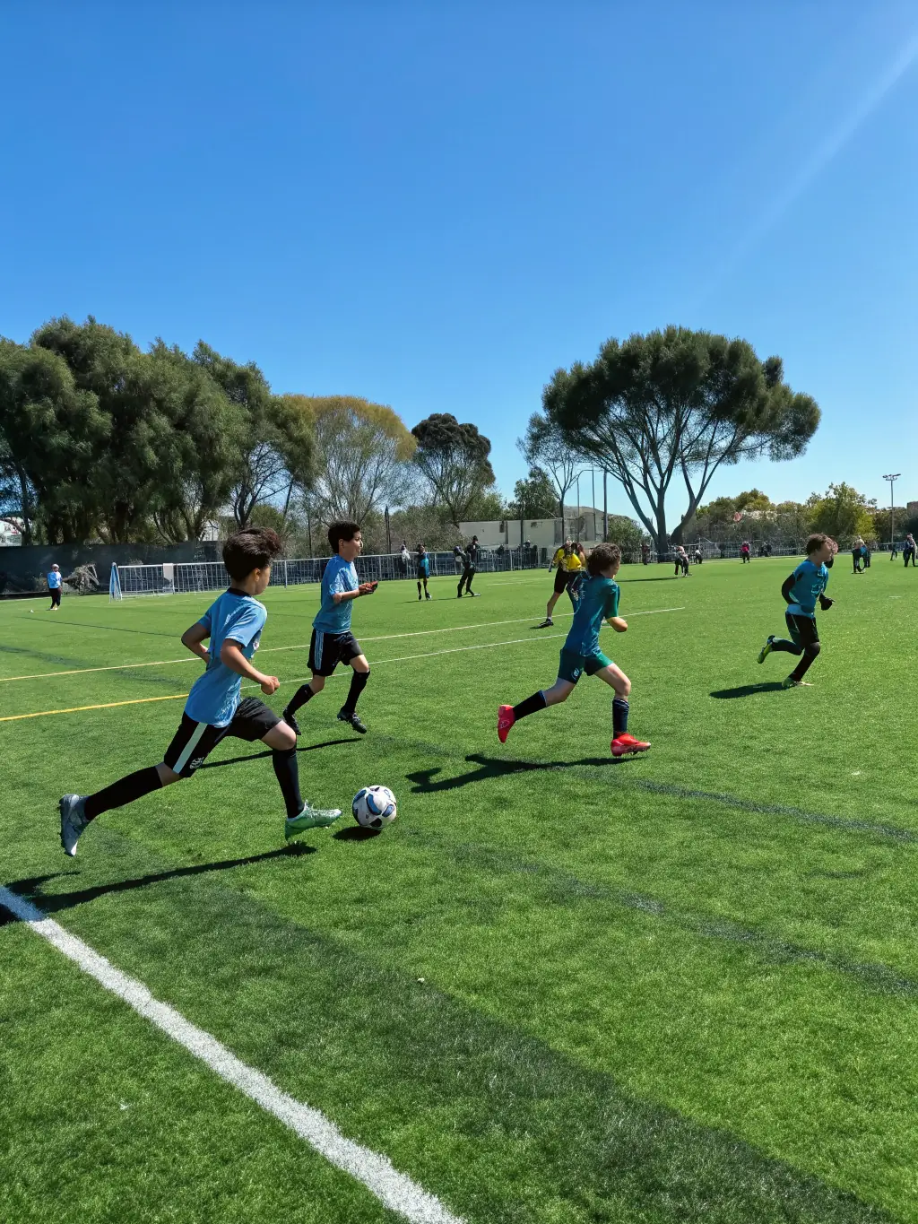 Students from ASSOCIATION SPORTIVE SCOLAIRE LES ACCACIAS are engaged in a soccer match, showcasing their athletic abilities and competitive spirit.